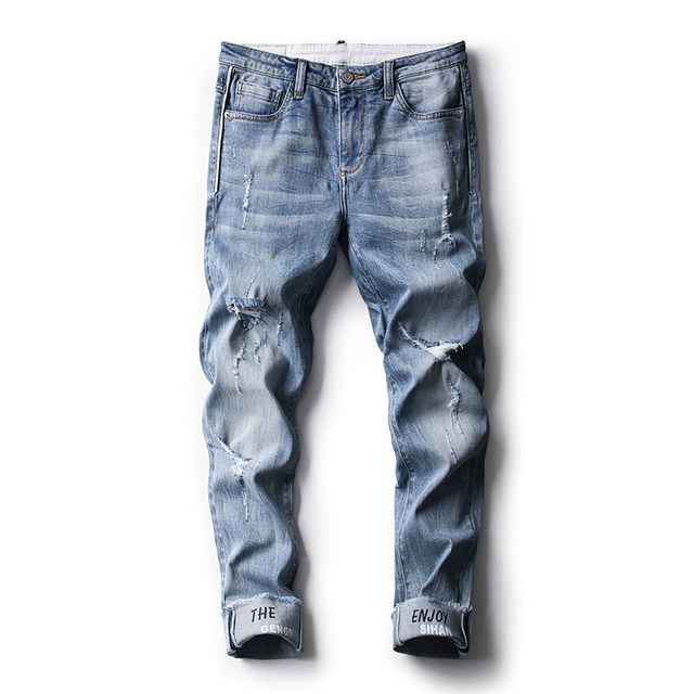 Thin stretch jeans for men in summer, light color, with holes in them Thin stretch jeans for men in summer, light color, with holes in them