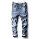 Thin stretch jeans for men in summer, light color, with holes in them Thin stretch jeans for men in summer, light color, with holes in them