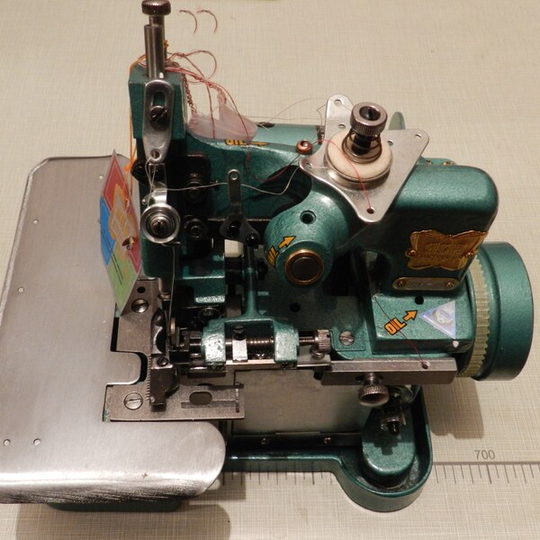 蝴蝶牌三线锁边缝纫机拷边机包边机包缝机丝绸雪纺牛仔裤制裁裤边