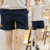 Mùa hè nam chạy thể dục quần short nam cotton giản dị kẹo màu hoang dã quần ba quần lỏng lẻo quần kaki nam Quần short