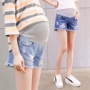 Quần bà bầu mùa hè nâng bụng quần jeans Thời trang bà bầu mặc quần lửng ống rộng Phiên bản Hàn Quốc của quần bà bầu quần đùi bầu