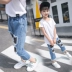 Cô gái lớn mặc mùa hè quần jean trẻ em Hàn Quốc phiên bản mới giản dị cô gái lưới đánh cá lỗ bảy điểm quần thủy triều shop trẻ em Quần jean