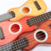 Trẻ em của mô phỏng mini ukulele có thể chơi nhạc cụ đàn piano bé âm nhạc nhỏ guitar nhựa guitar đồ chơi Đồ chơi âm nhạc / nhạc cụ Chirldren