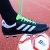Bị hỏng móng tay trẻ em giày bóng đá trường tiểu học đào tạo giày nam giới và phụ nữ giày thể thao dành cho người lớn móng tay dài đích thực cỏ nhân tạo trái đất giày