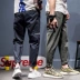 UXE Nhật Bản đơn giản màu rắn thêu quần nam retro Harajuku overalls thủy triều sinh viên thương hiệu quần hoang dã