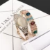 Nhà máy trực tiếp quầy đồ trang sức lớn kim cương Hàn Quốc vòng đeo tay mắt mèo của phụ nữ thời trang màu chuỗi đeo tay Vòng đeo tay Cuff