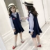 Quần áo bé gái gió đại học quần áo nữ mùa thu 2018 mới to boy dài tay giả hai váy trẻ em nước ngoài Váy