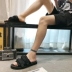 Phong cách Hồng Kông mùa hè vải thoáng khí dép nam và nữ Phiên bản tiếng Hàn của từ kéo dép chống trượt đôi giày đi biển hoang dã - Dép