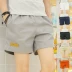 Mùa hè quần short nam xu hướng Hàn Quốc phiên bản của mỏng ống túm đàn ông ba điểm ku bông giản dị siêu quần short thể thao kích thước nhỏ quần quần tây âu Quần tây thường