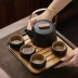 Tùy chỉnh 
            gốm đen chùm nồi du lịch kung fu bộ trà nhà ấm trà khay trà túi xách tay một nồi bốn cốc tùy chỉnh LOGO