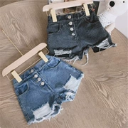 Cô gái mùa xuân và mùa hè mặc quần jeans lỗ 2019 Phiên bản Hàn Quốc của trẻ em và trẻ em mặc bị đứt nút denim quần nóng thủy triều - Quần jean