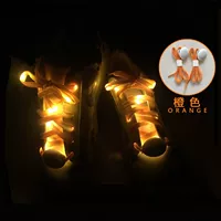 Светящиеся шнурки оранжевого света и пара пар батареи CR2032