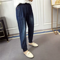 Mùa xuân và mùa hè eo đàn hồi eo cao jeans Hàn Quốc giản dị hoang dã rửa jeans củ cải quần quần phụ nữ quần jean nữ