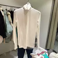 QNI Hàn Quốc mua áo nữ mùa thu 2018 mới áo thun cổ cao Dongdaemun 110110 áo phông trắng