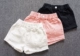 Cô gái quần short denim 2018 mùa hè mới Hàn Quốc phiên bản của lỗ trong trẻ em lớn trẻ em màu trắng thời trang lỏng quần nóng thủy triều quần jean bé trai Quần jean