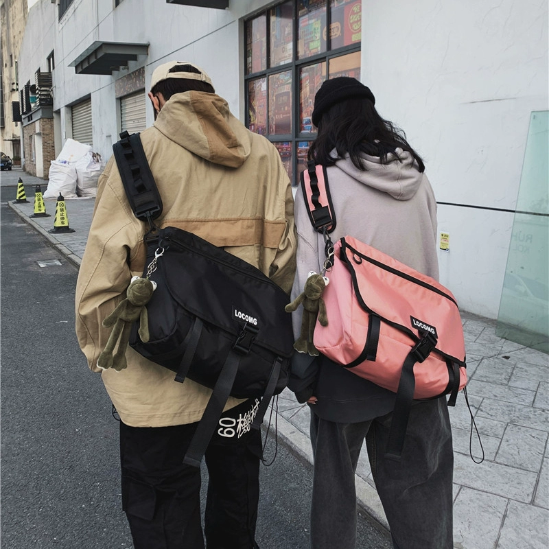 Tide thương hiệu túi messenger nam cá tính túi hoang dã vai nữ Nhật Bản túi sinh viên Nhật Bản công suất lớn cưỡi vai túi - Túi của con người