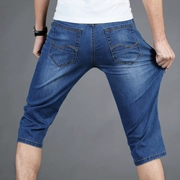 Mùa hè mỏng phần cao co giãn denim quần short nam bảy quần thun tự canh kích thước lớn thanh niên quần nam 7 quần - Quần jean