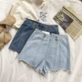 RENA thiết kế mùa hè phía sau dây kéo nút kim loại trang trí retro cao eo là mỏng quần short denim hoang dã quần jean nữ rách