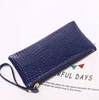 Small clutch bag, old-fashioned mobile phone