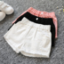 Cô gái mùa hè quần short denim Hàn Quốc phiên bản của lỗ trong trẻ em lớn trẻ em bông trắng mặc hoang dã lỏng quần nóng Quần jean
