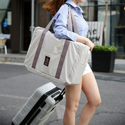 Phiên bản tiếng Hàn của túi xách nữ du lịch xách tay dung lượng lớn túi lưu trữ khoảng cách hành lý ngắn túi thể dục túi đeo vai được sản xuất
