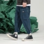 Studio cứng đầu Chinism màu xanh hải quân bỏ túi lớn áo liền quần dây rút chân rộng quần jean nam quần áo nam